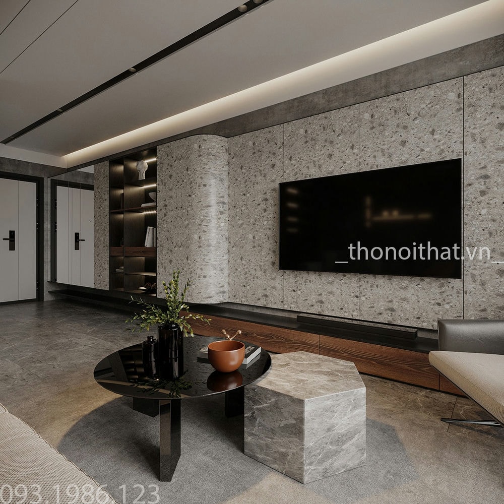 Sử dụng bàn tròn đen cùng chiếc bàn đá lập phương đặt giữa phòng khách