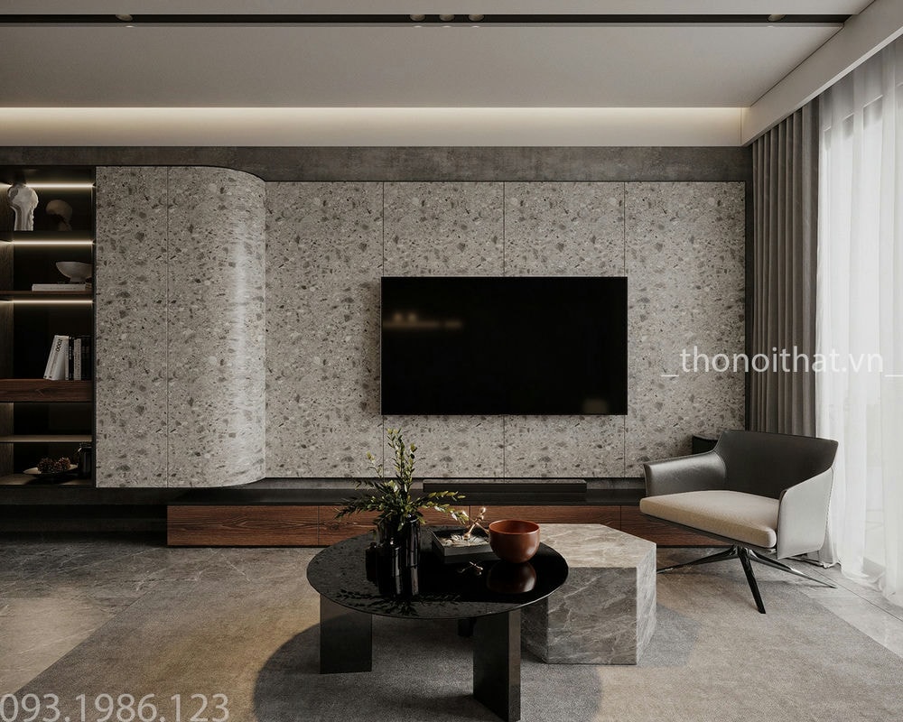 Ốp tường sau tivi sử dụng kiểu giấy dán tường vân đá khá đặc sắc