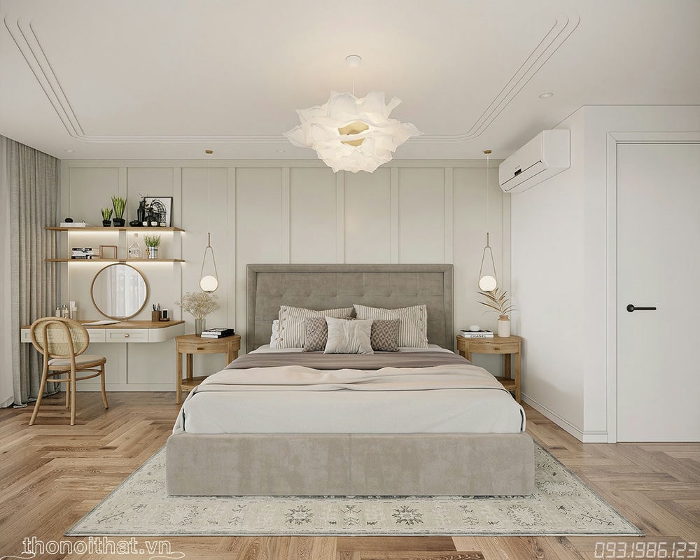 Chiếc giường là điểm tâm của căn phòng đặt trên chiếc thảm hoa cùng bàn trang điểm tiện ích