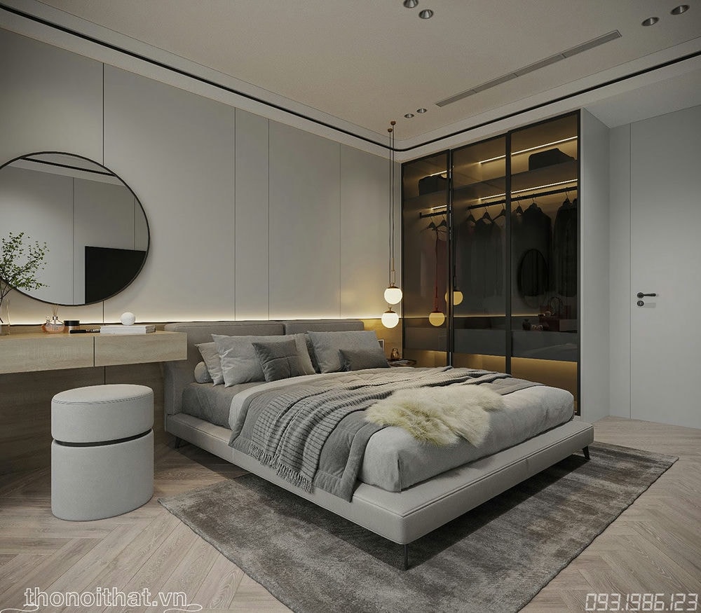Bên cạnh chiếc giường là tủ để đồ có cánh kính cùng đèn led vàng tạo ra sự huyền ảo nơi đây, cùng chiếc bàn trang điểm được thiết kế hiện đại với ghế ngồi tròn