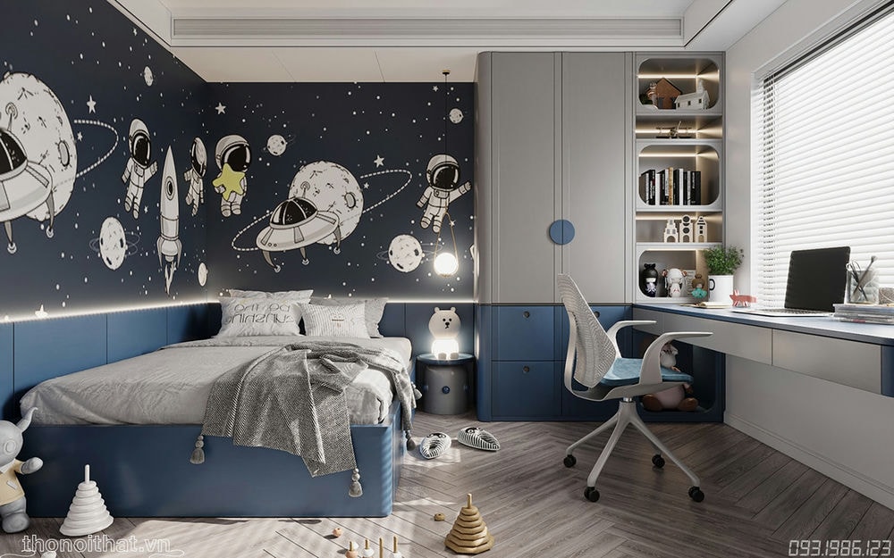 Chiếc giường nhỏ nhắn, xinh xắn được thiết kế gọn vào một góc nhỏ, trên tường trang trí tranh vũ trụ