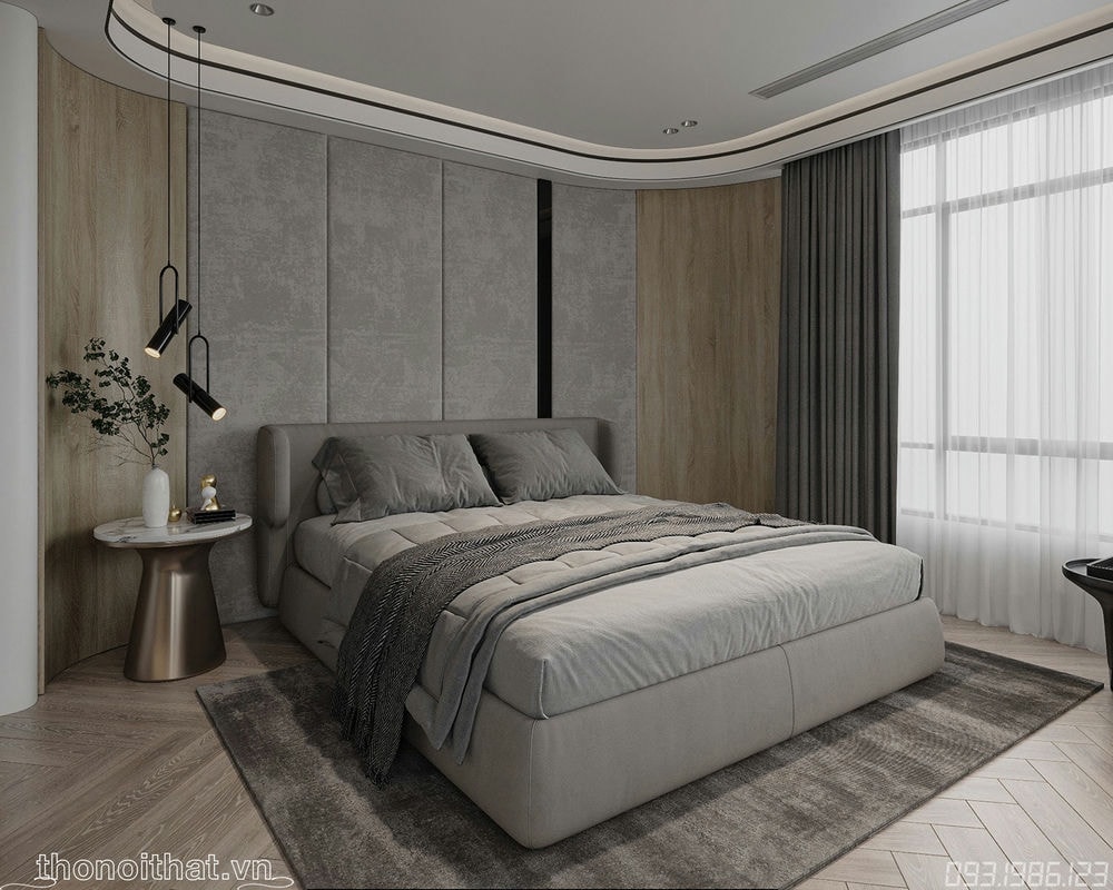 Phòng ngủ với chiếc giường đệm dày đặt trên thảm màu lông chuột giữa phòng